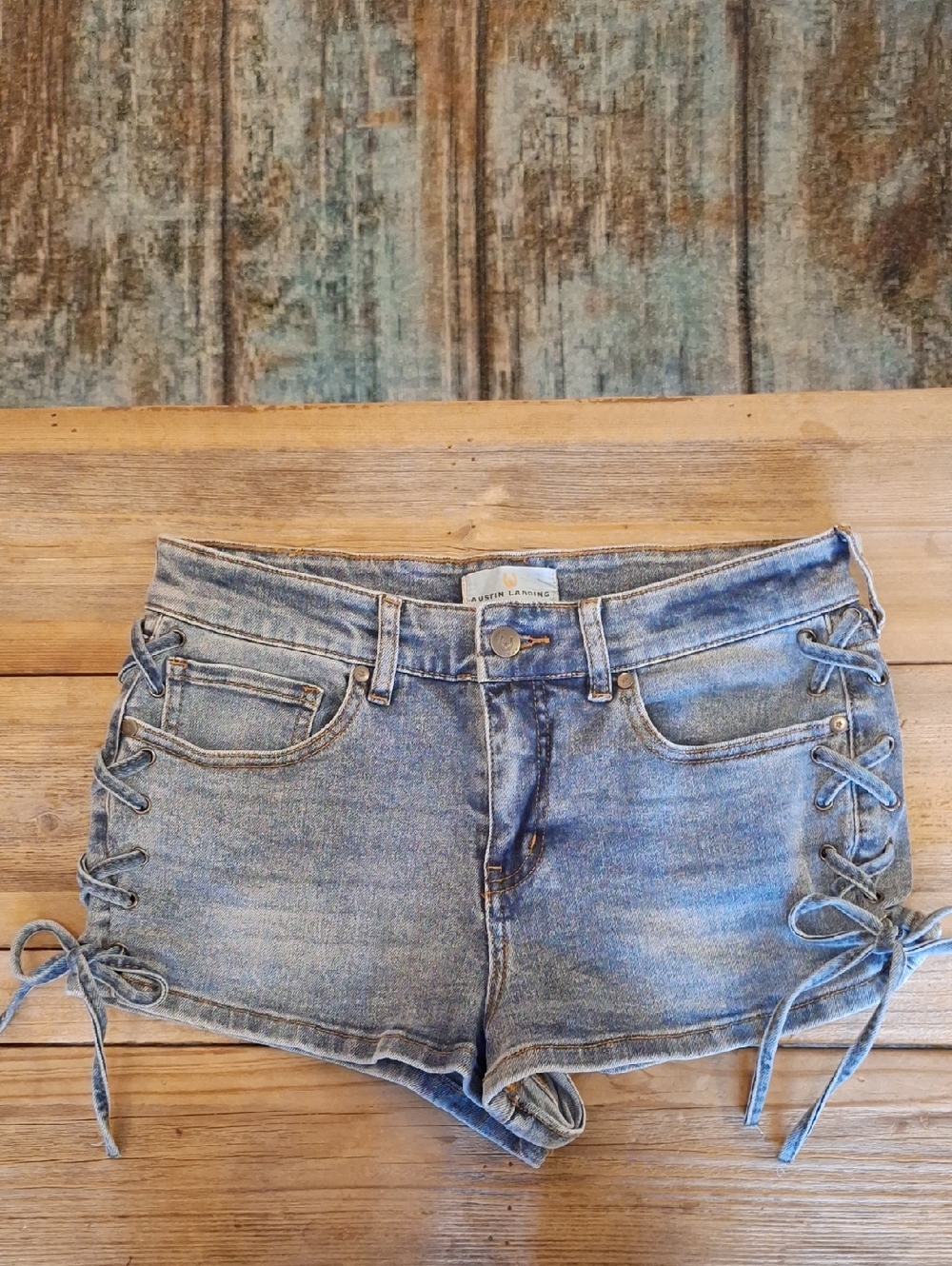 Women’s Light Blue Lace-Up Side Denim Shorts. Size 7